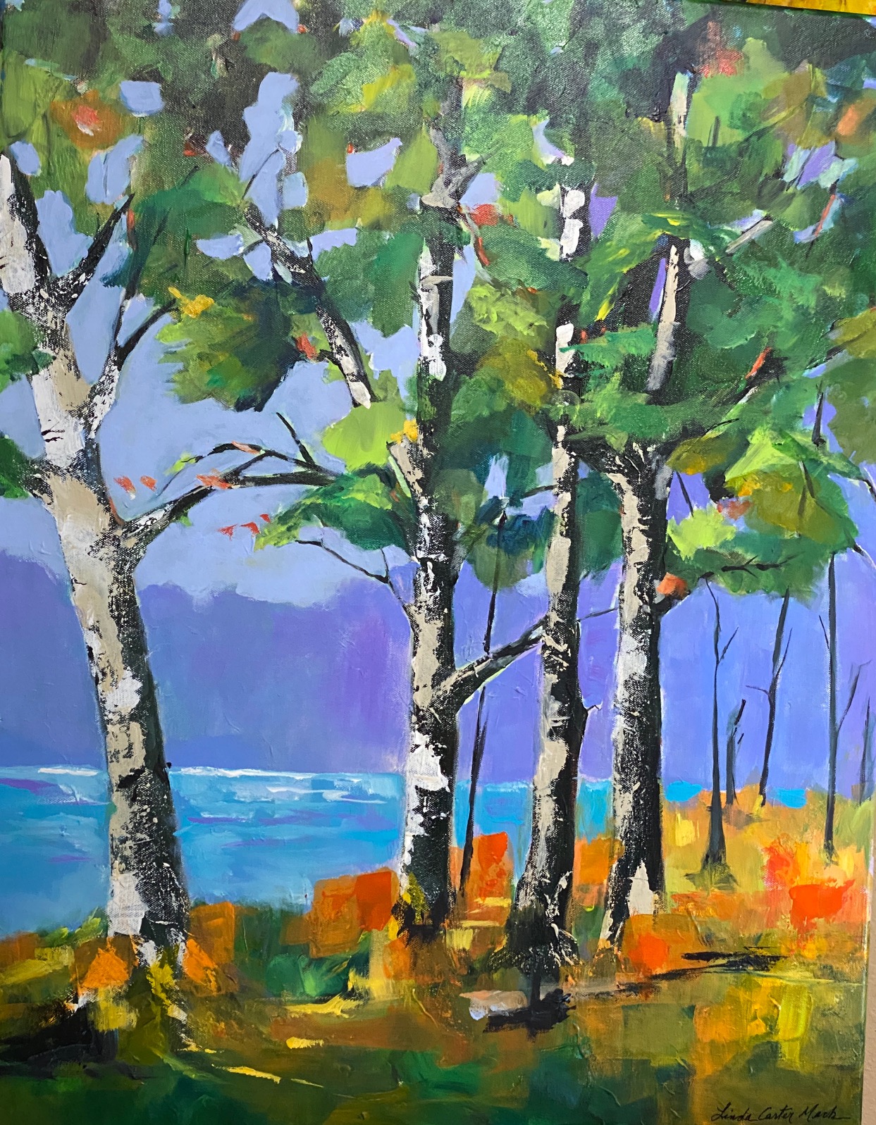 A painting of trees on the water